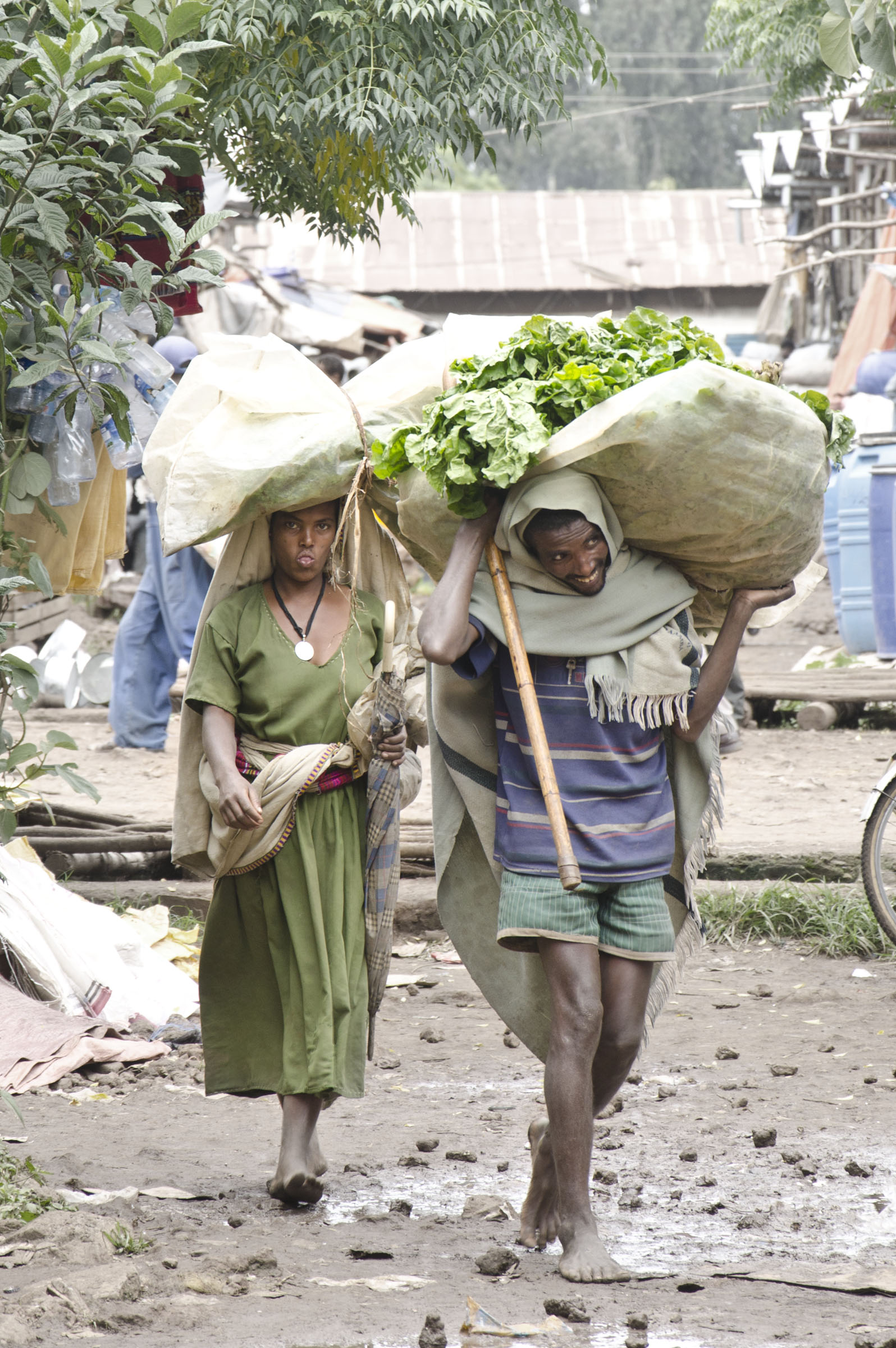 Bahir Dar, Ethiopia couple carry goods from market