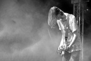 guitarist with rock band the Asylums live on Leftfield Stage at Glastonbury Festival